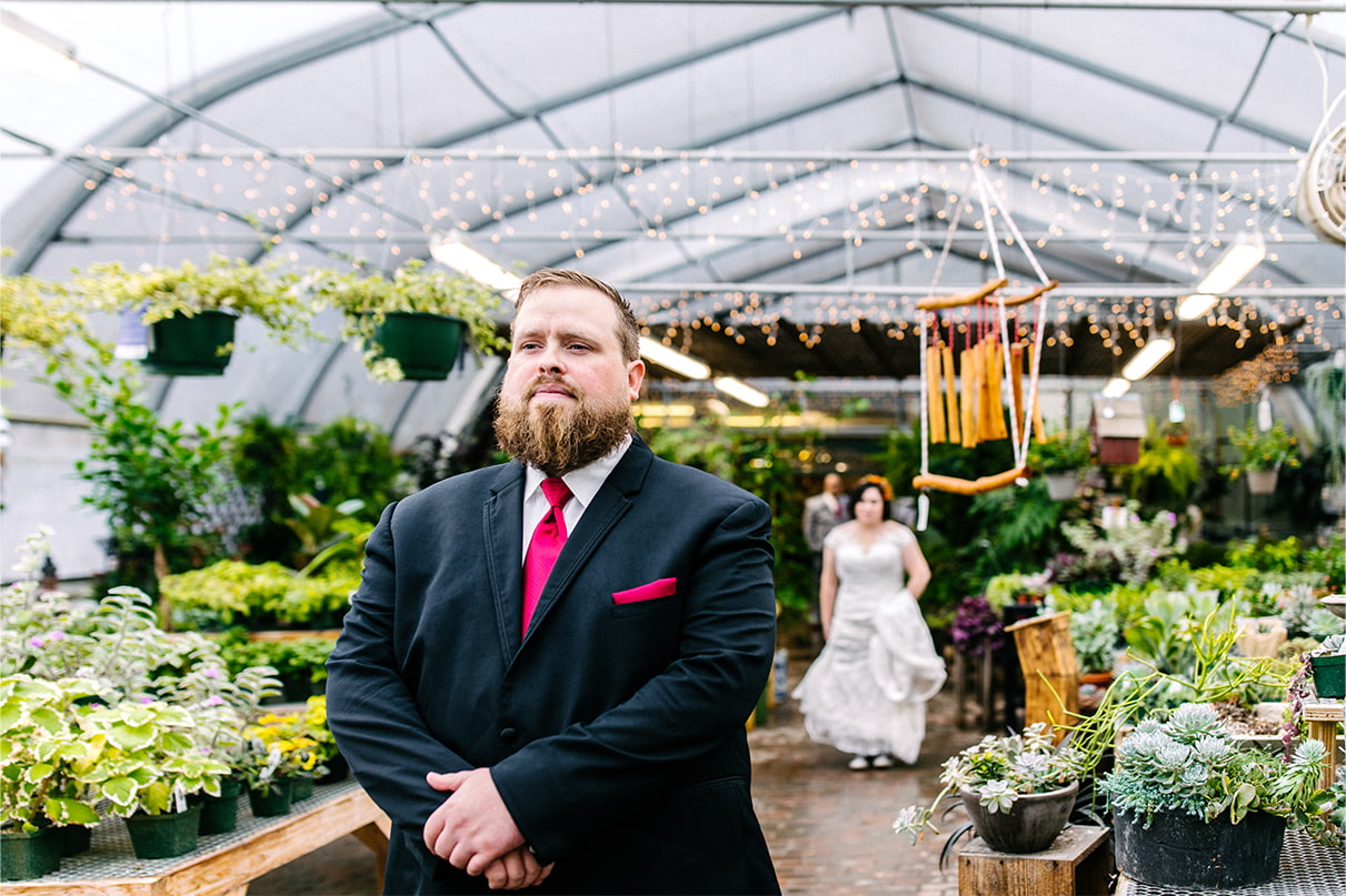 Groom waits to see bride for the first time at Carol Watson Greenhouse in Lafayette NY