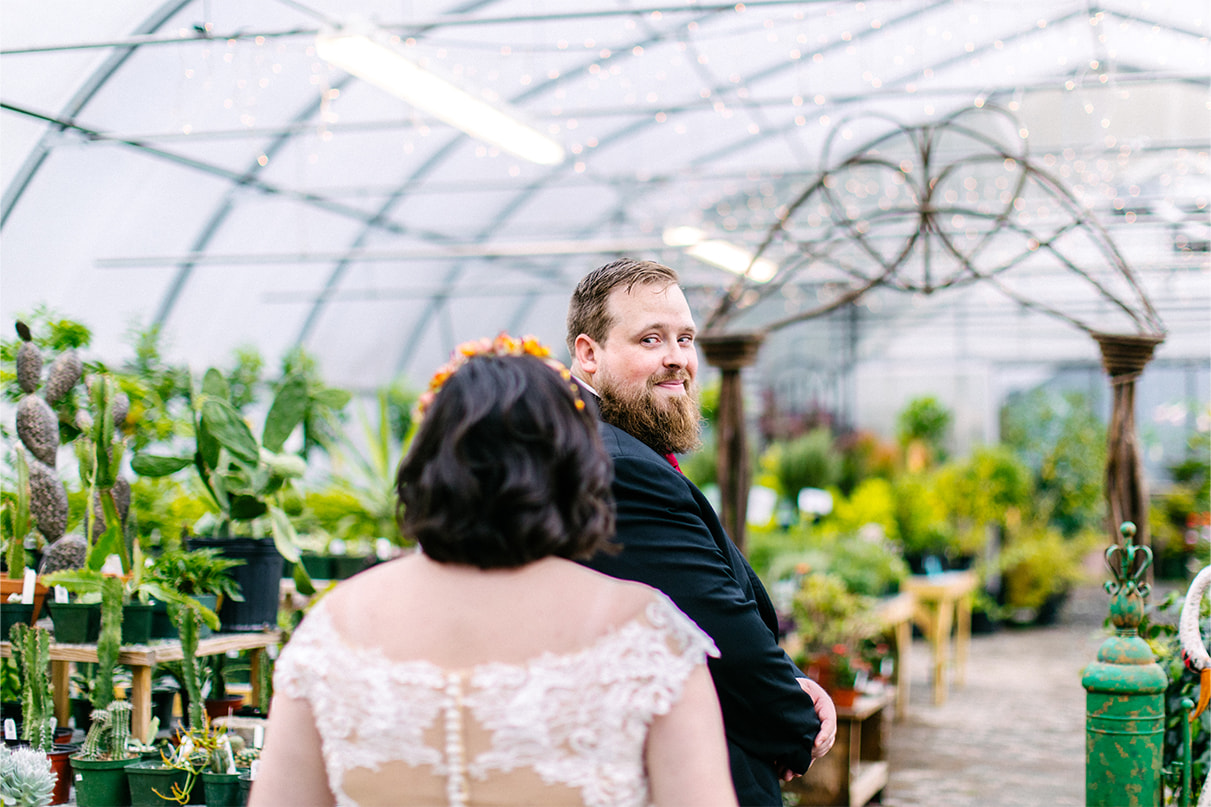 Groom sees bride for the first time at Carol Watson Greenhouse in Lafayette NY