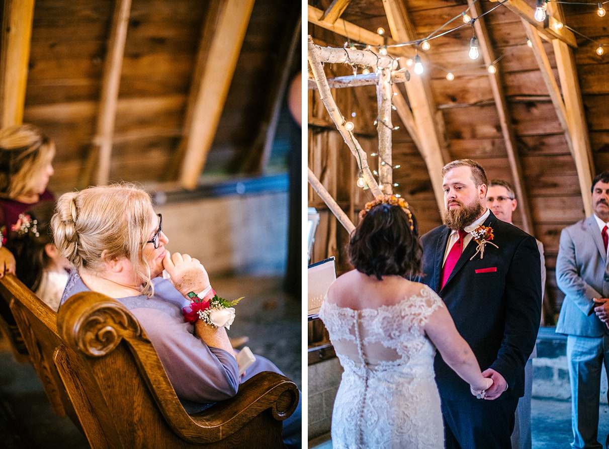 Mother of the bride and groom look at bride during wedding ceremony in the toolshed at Arlington Acres in Lafayette NY