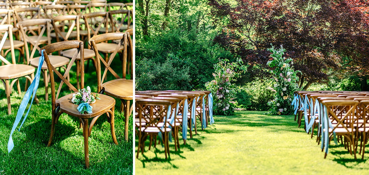 The lawn at The Bird and Bottle Inn decorated for a wedding ceremony with chairs tied with blue ribbons and two pillars of flowers and greenery