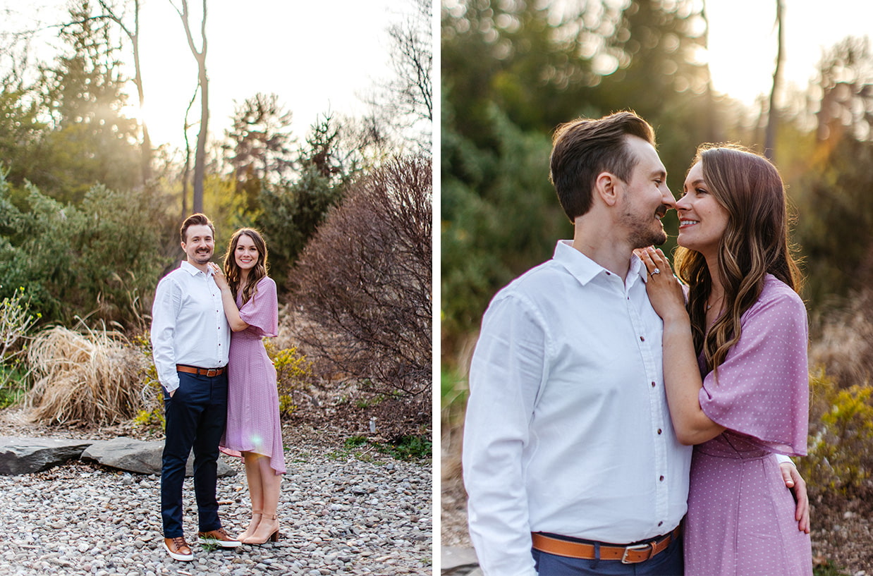 Man and woman in white dress shirt and lavender dress stands together and smiles for engagement photos