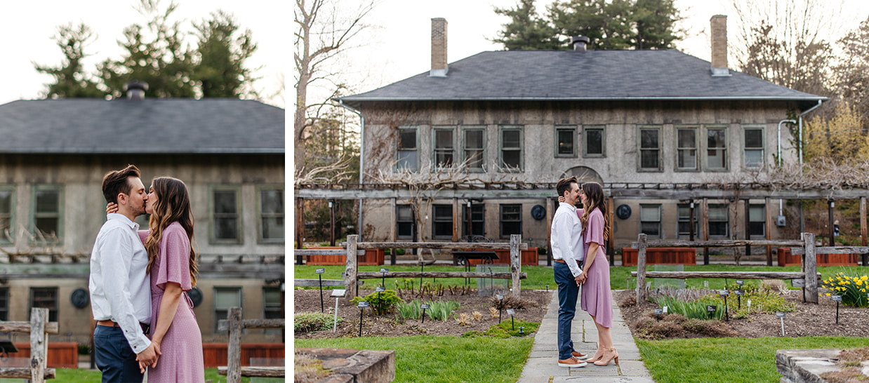 Couple stands in front of historic home at engagement session at Cornell Botanic Gardens in Ithaca NY