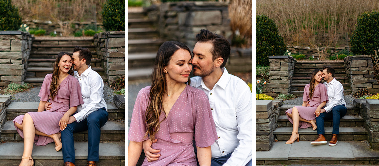Man in white button down shirt sits on garden stairs next to woman in flowy lavender dress