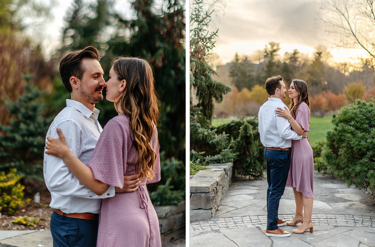 Couple embraces in garden during golden-hour engagement session
