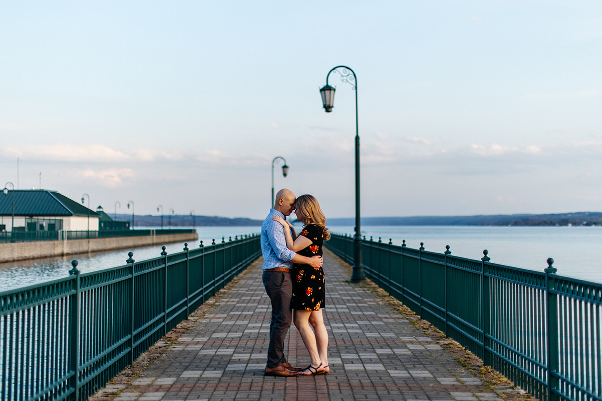 Couple embraces on Emerson Park pier in Auburn NY