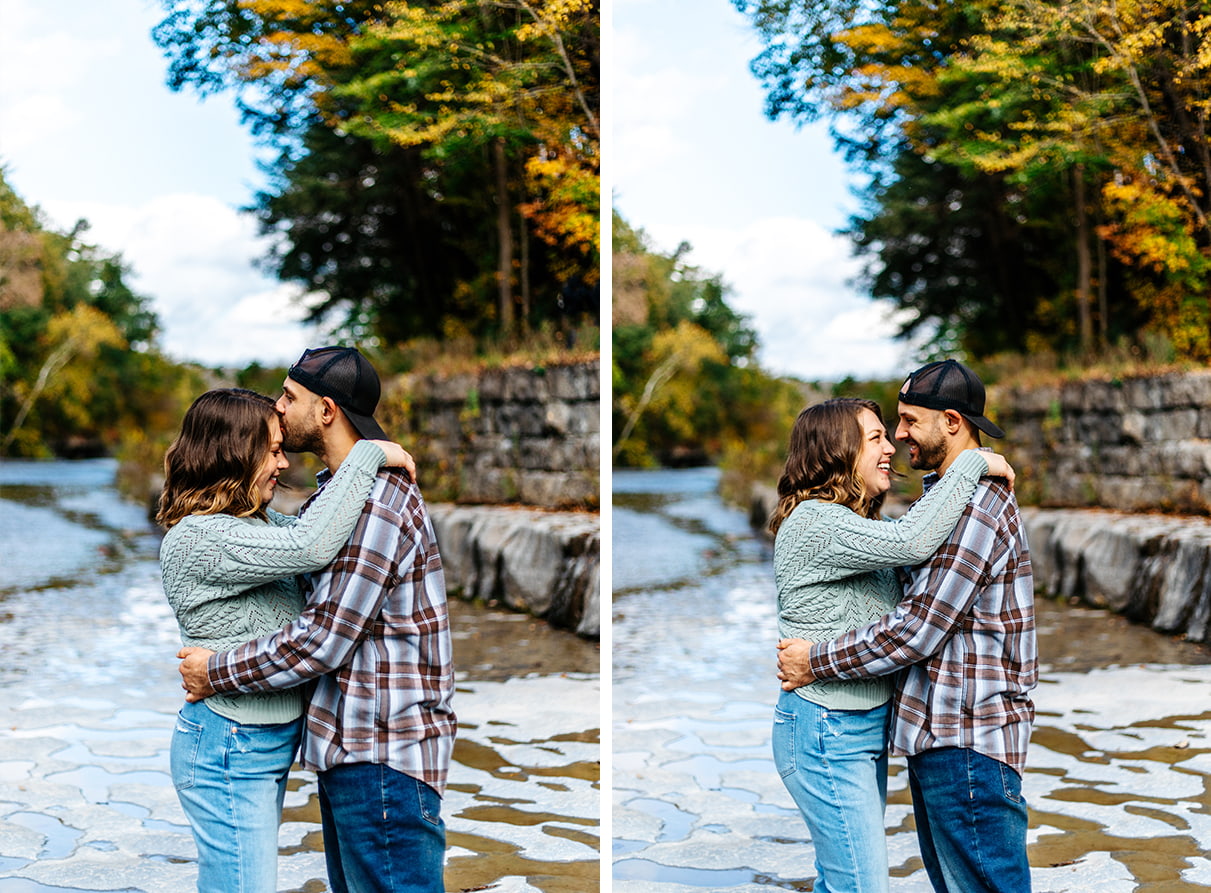 Couple embracing, smiling, and laughing, while standing on river rocks at Taughannock Falls State Park in Trumansburg, NY