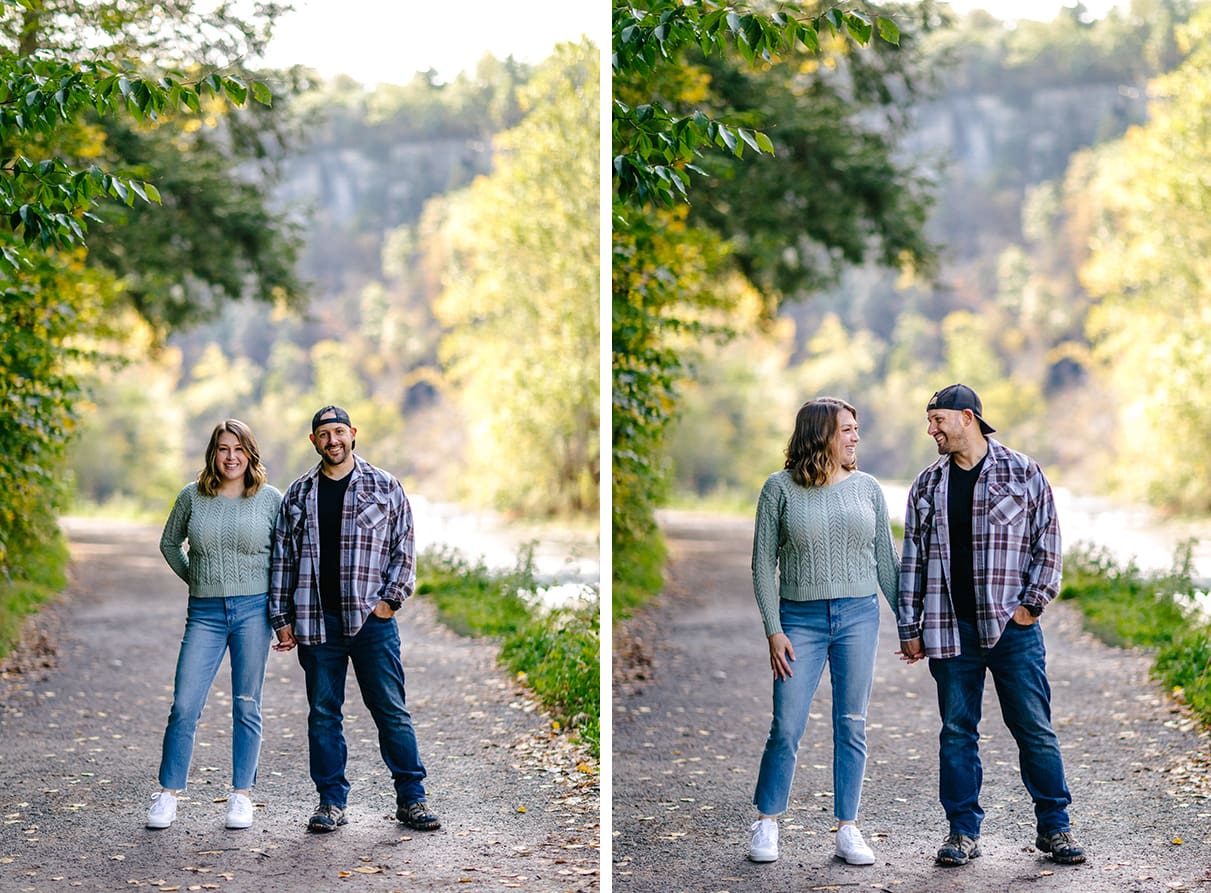Couple holding hands and standing on trail at Taughannock Falls State Park in Trumansburg, NY