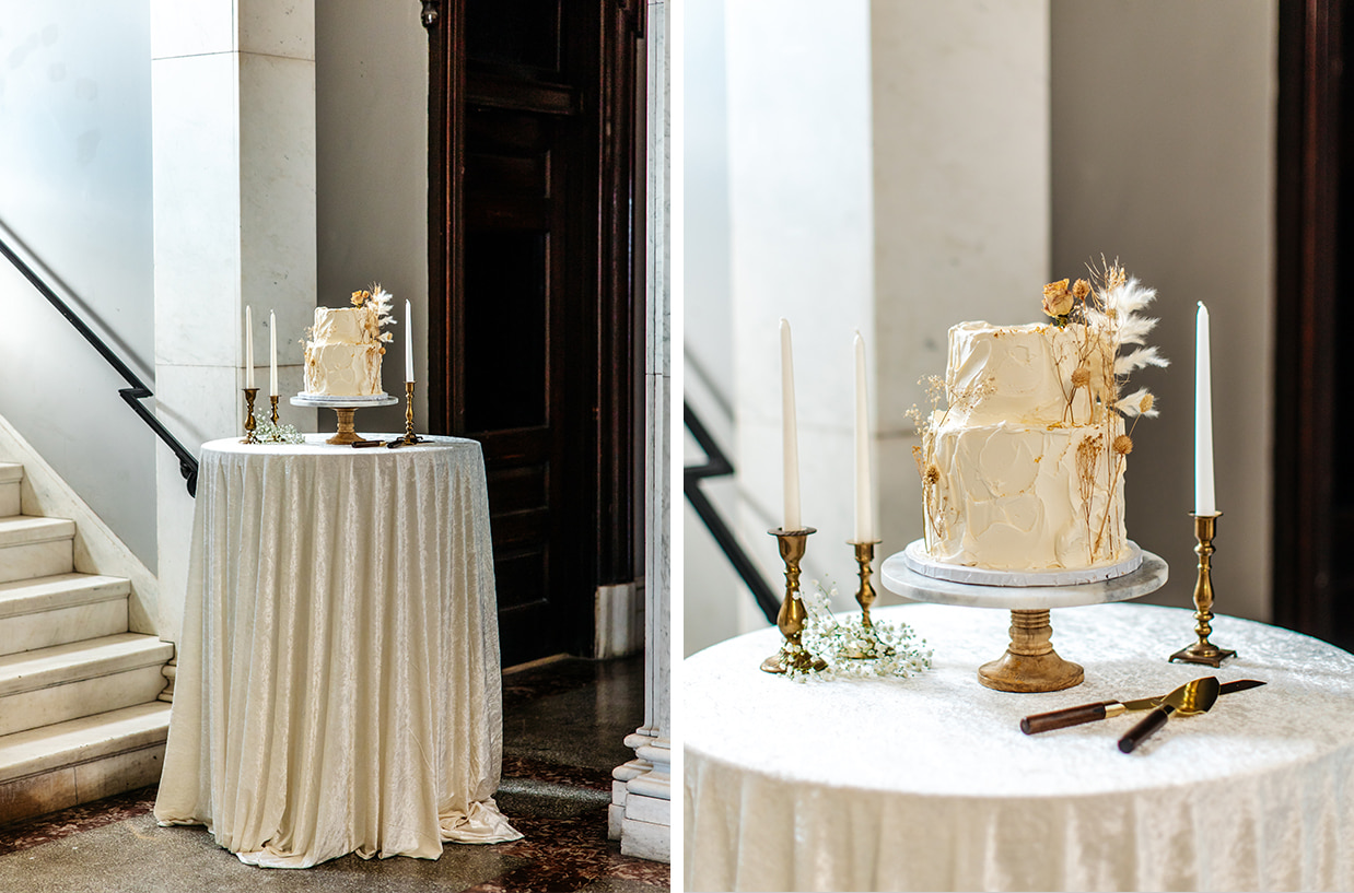 Ultra-textured monochromatic wedding cake with dried flowers set on a table with white taper candles