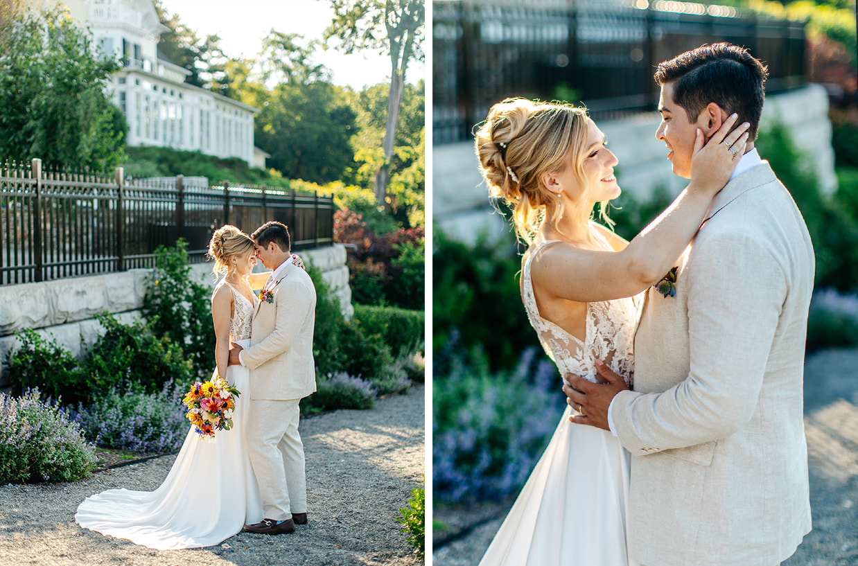 Bride and Groom stand in golden hour light with their foreheads together. They are standing on the path next to The Inn at Taughannock Falls and the bride is holding a colorful wildflower bouquet. You can see the Inn behind them