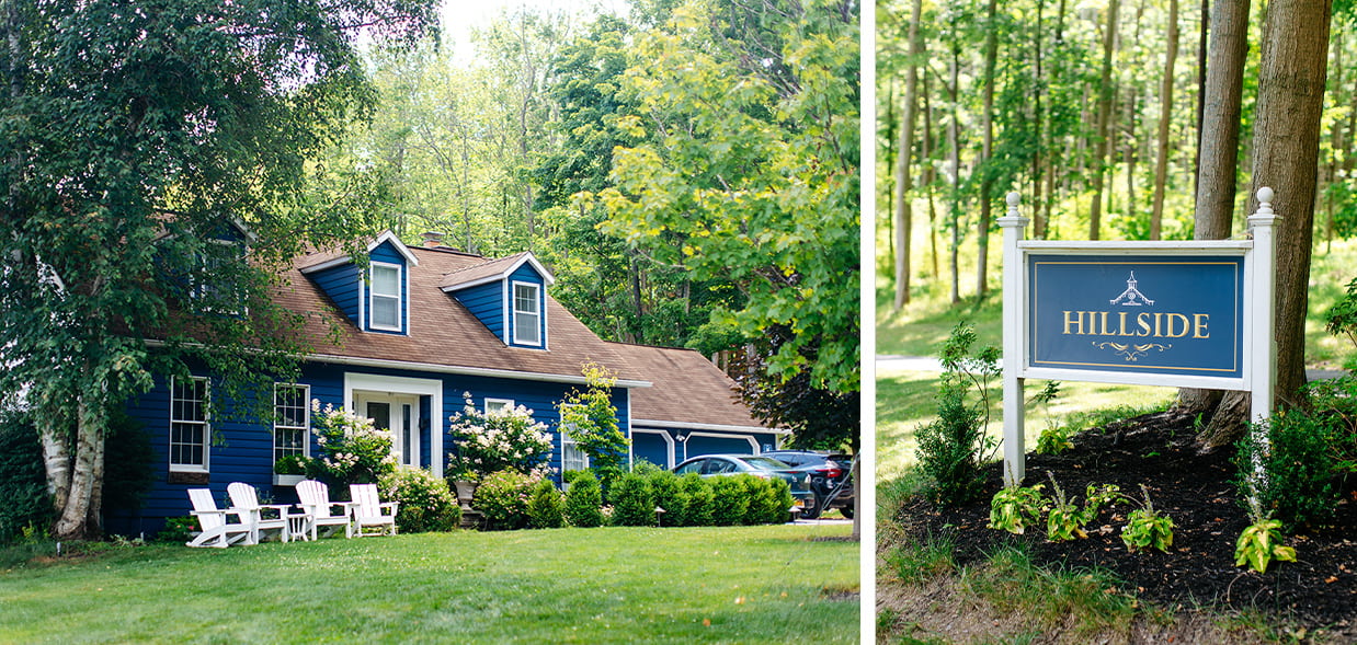 The Inn and Taughannock's Hillside Lakehouse. It is a blue house surrounded with greenery and white flowers. There is also a sign that says 