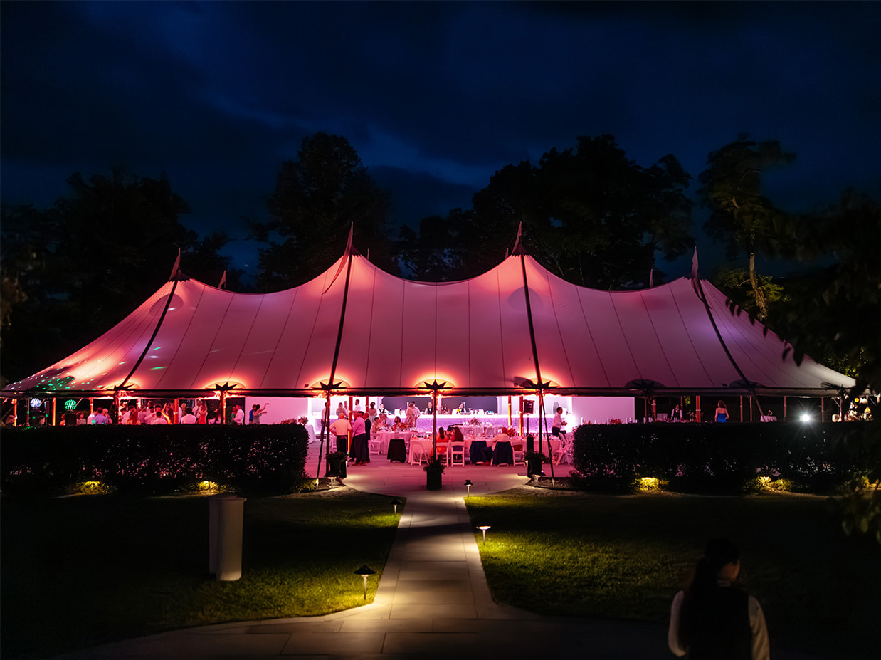 Exterior of the enchantment tent at The Inn at Taughannock Falls lit up at night