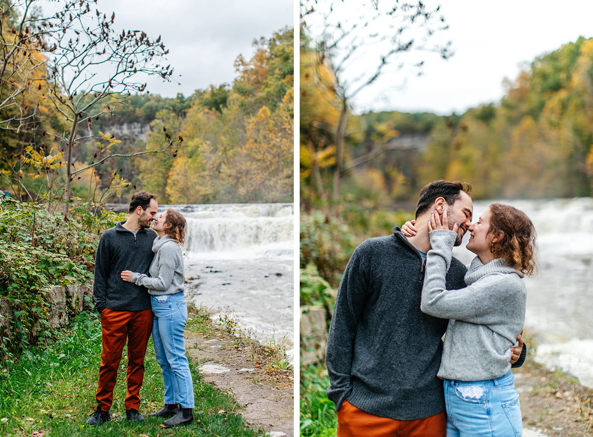 Couple stands in front of falls at Taughannock Falls State Park