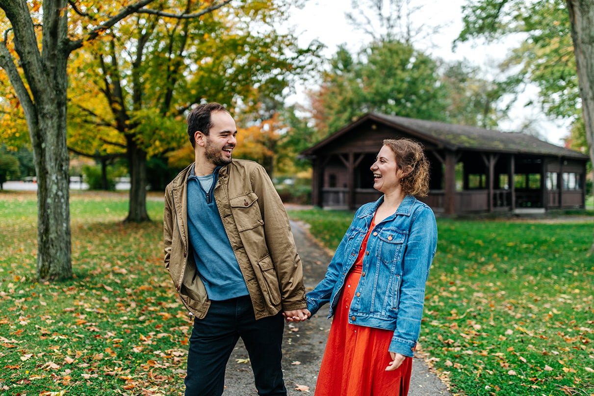 Couple looks at each other and laughs at Taughannock Falls State Park in Trumansburg NY