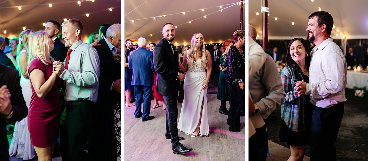 Bride and groom smile and laugh while standing on the dance floor at their reception. Other guests are dancing and smiling