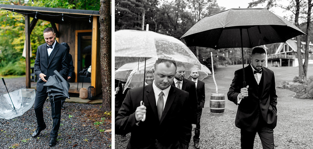 Groom smiling and walking under an umbrella with his groomsmen on a rainy wedding day