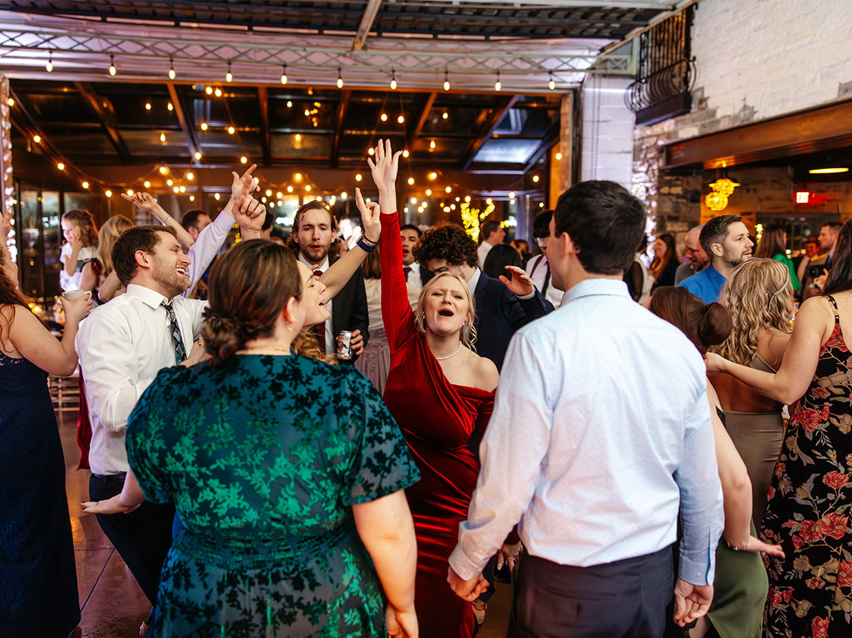 Guests dance during wedding reception at The Sinclair of Skaneateles in Skaneateles NY