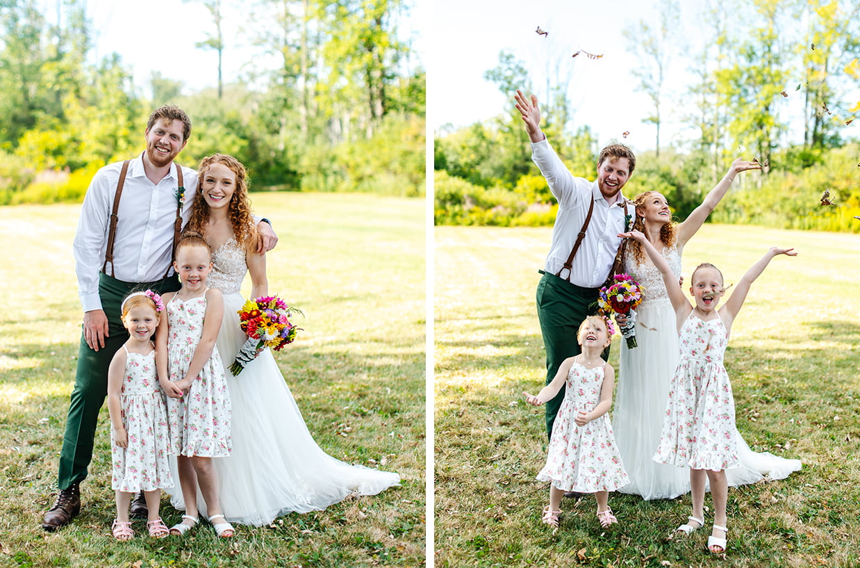 red headed bride and groom throw leaves in the air with their red headed flower girls in white and pink floral dresses