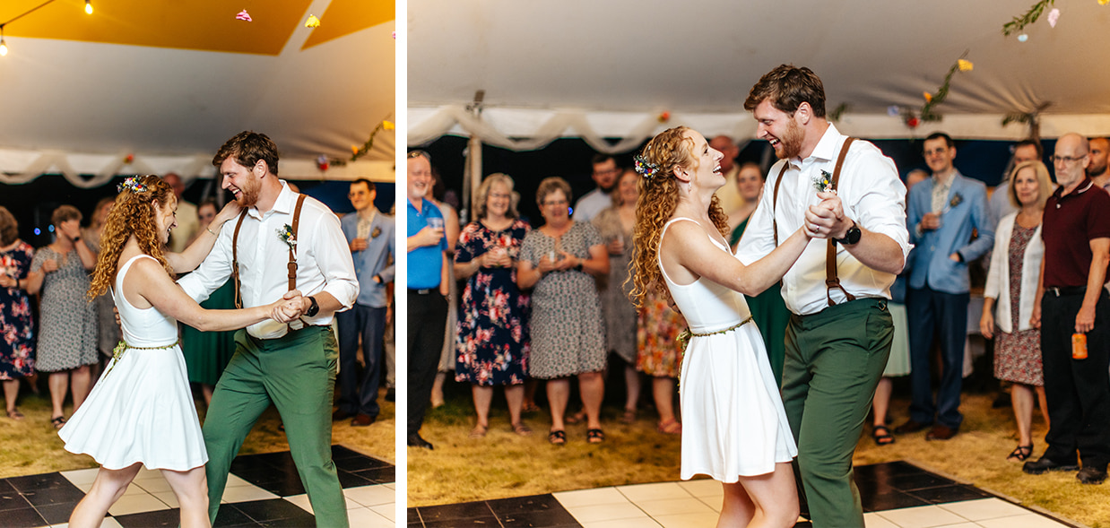 bride and groom share their first dance in a tented reception with a black and white checkerboard dance floor
