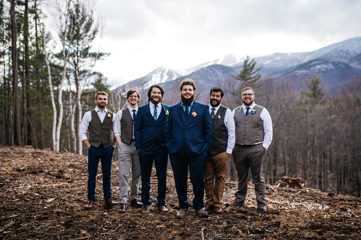 Groom with groomsmen in front of whiteface mountain