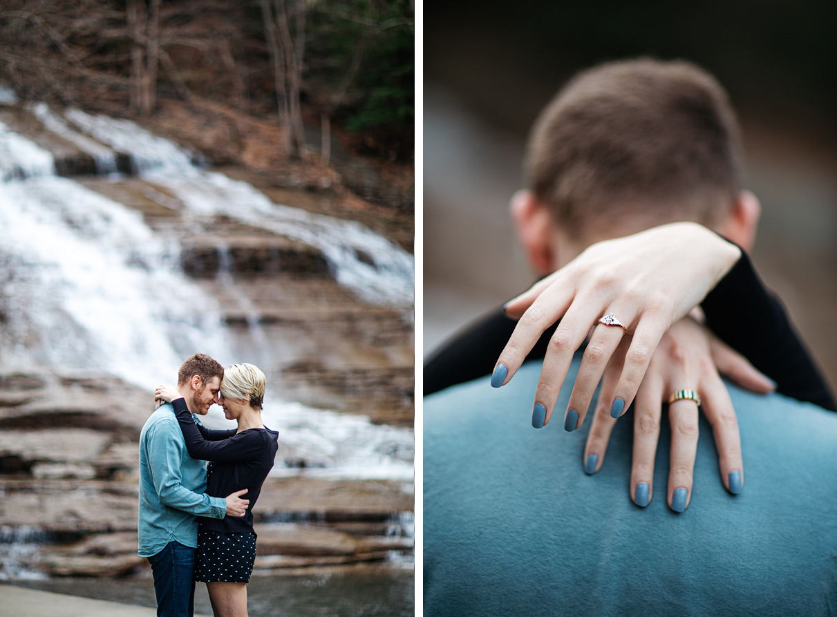 Couple embrases with heads together and shows off engagement ring at Buttermilk Falls in Ithaca NY