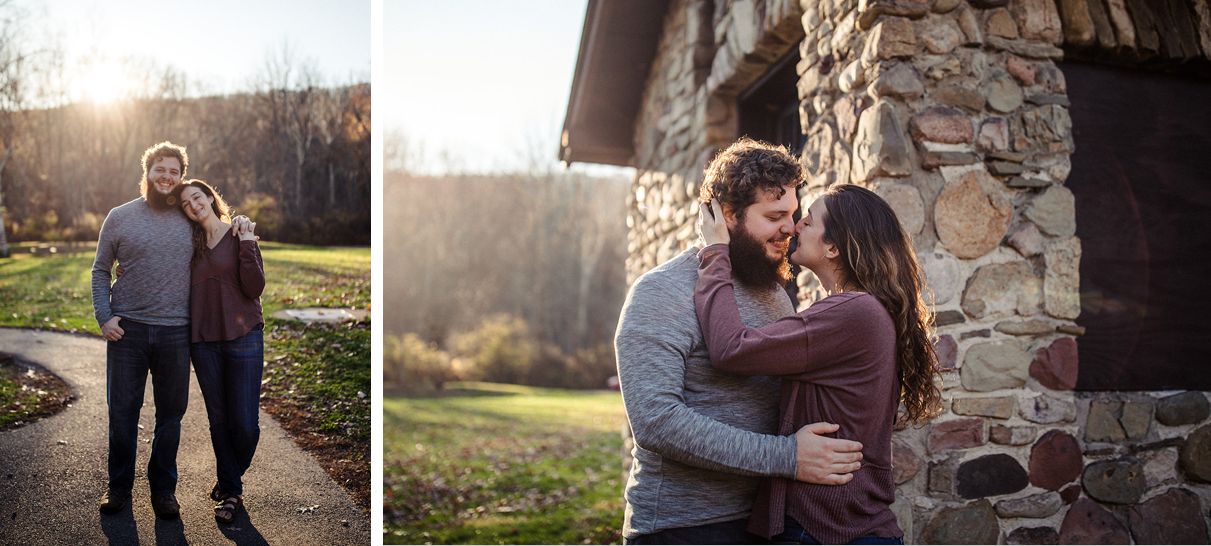 Couple holds hands and embraces in front of stone building at Chenango Valley State Park