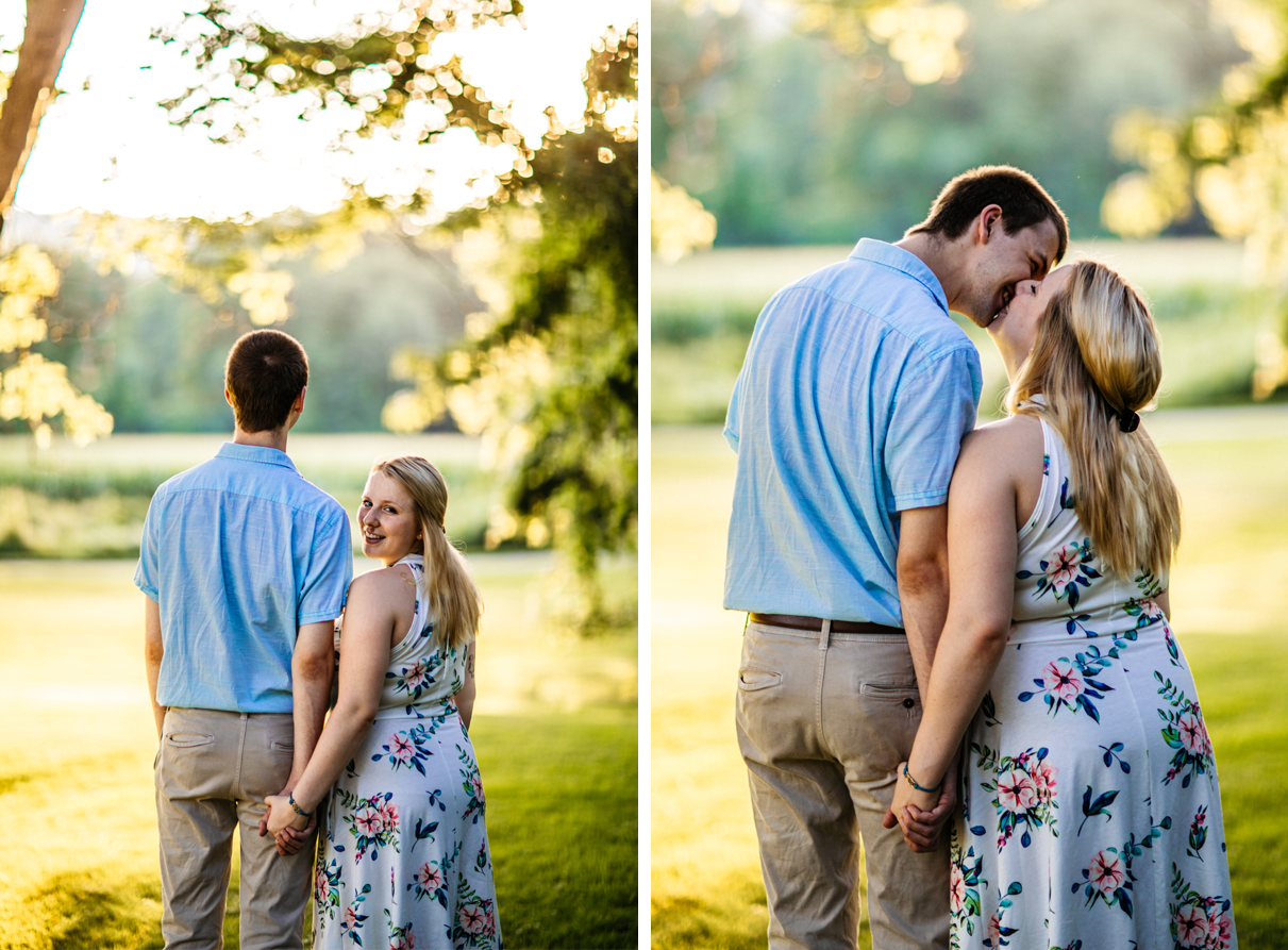 couple holds hands and woman smiles in colorful dress