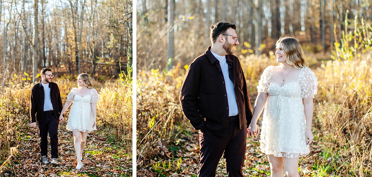couple holds hands while walking through the woods during engagement photos in Cooperstown NY