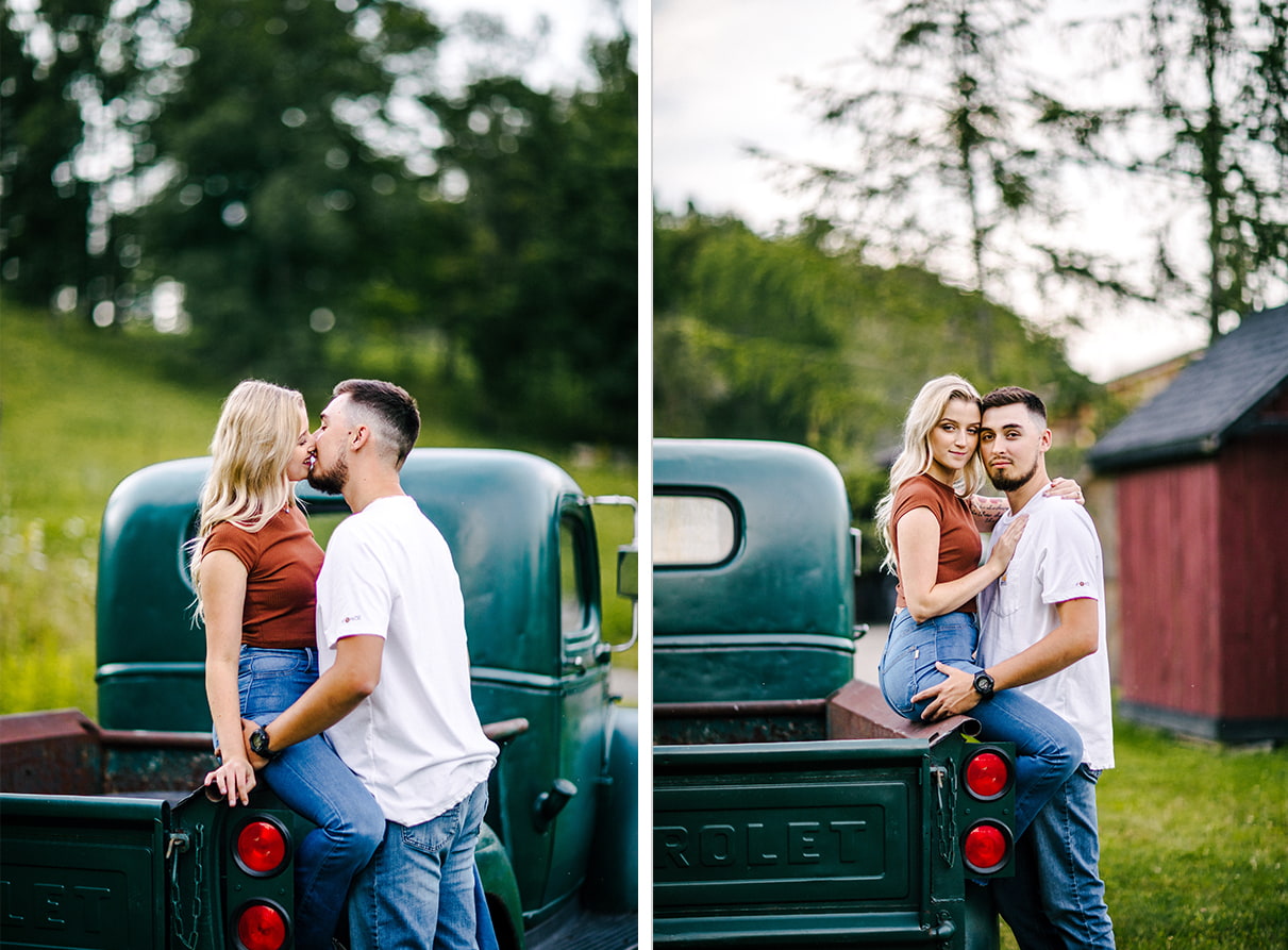 woman sits on edge of green vintage chevy truck bed while embracing her Fiancé