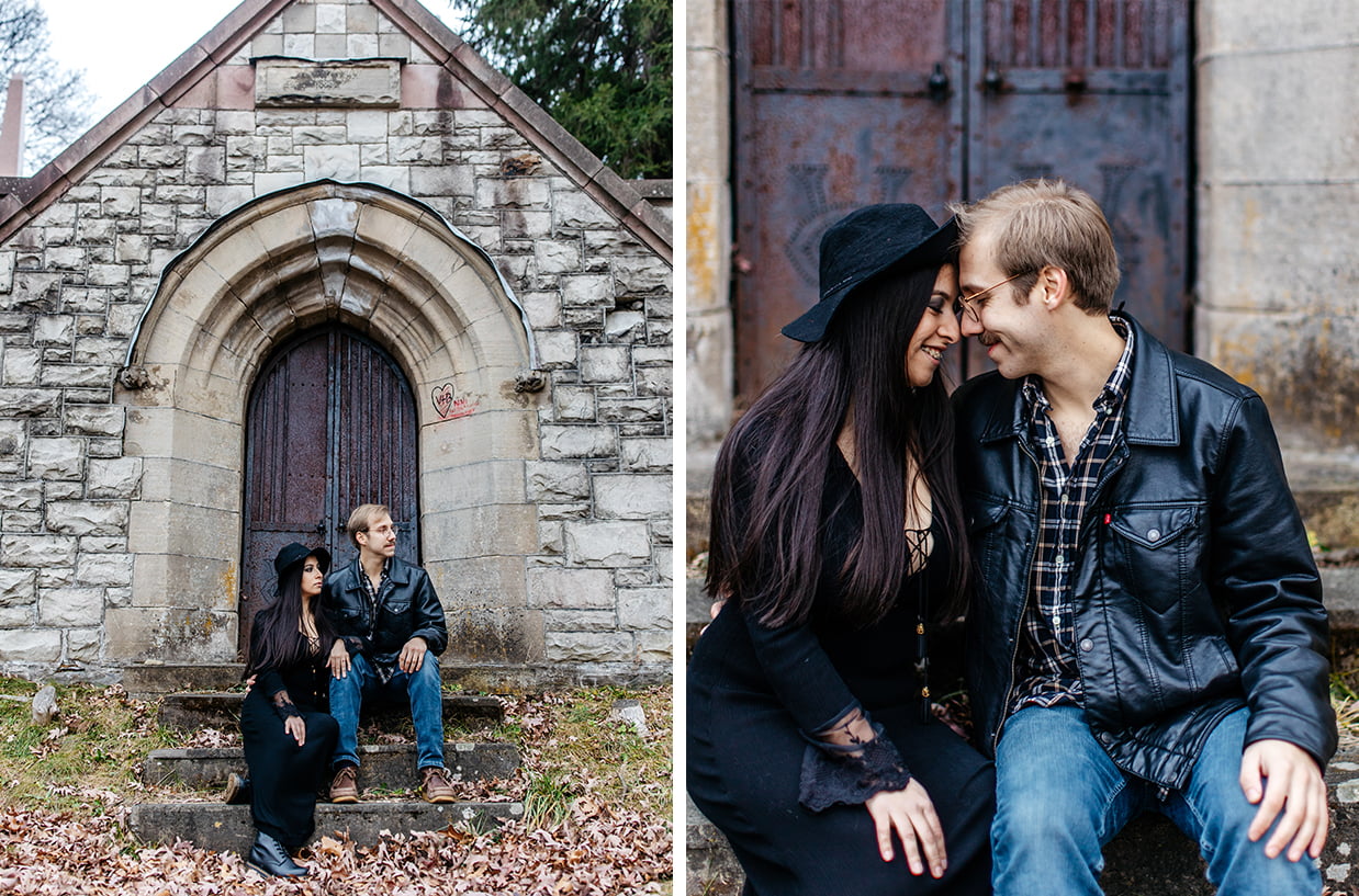 couple sits on steps of cemetery mausoleum during halloween engagement session