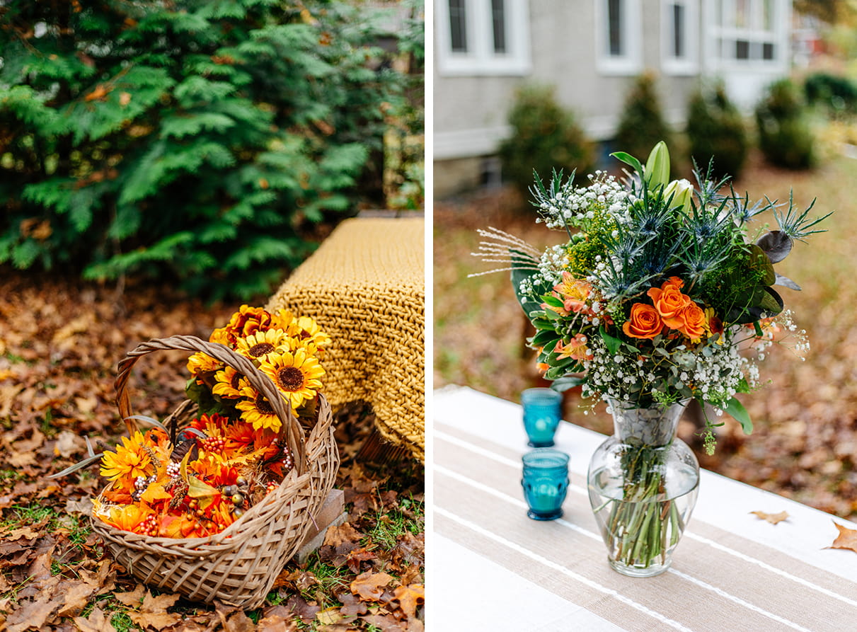 picnic basket and blue vase full of fall leaves and flowers