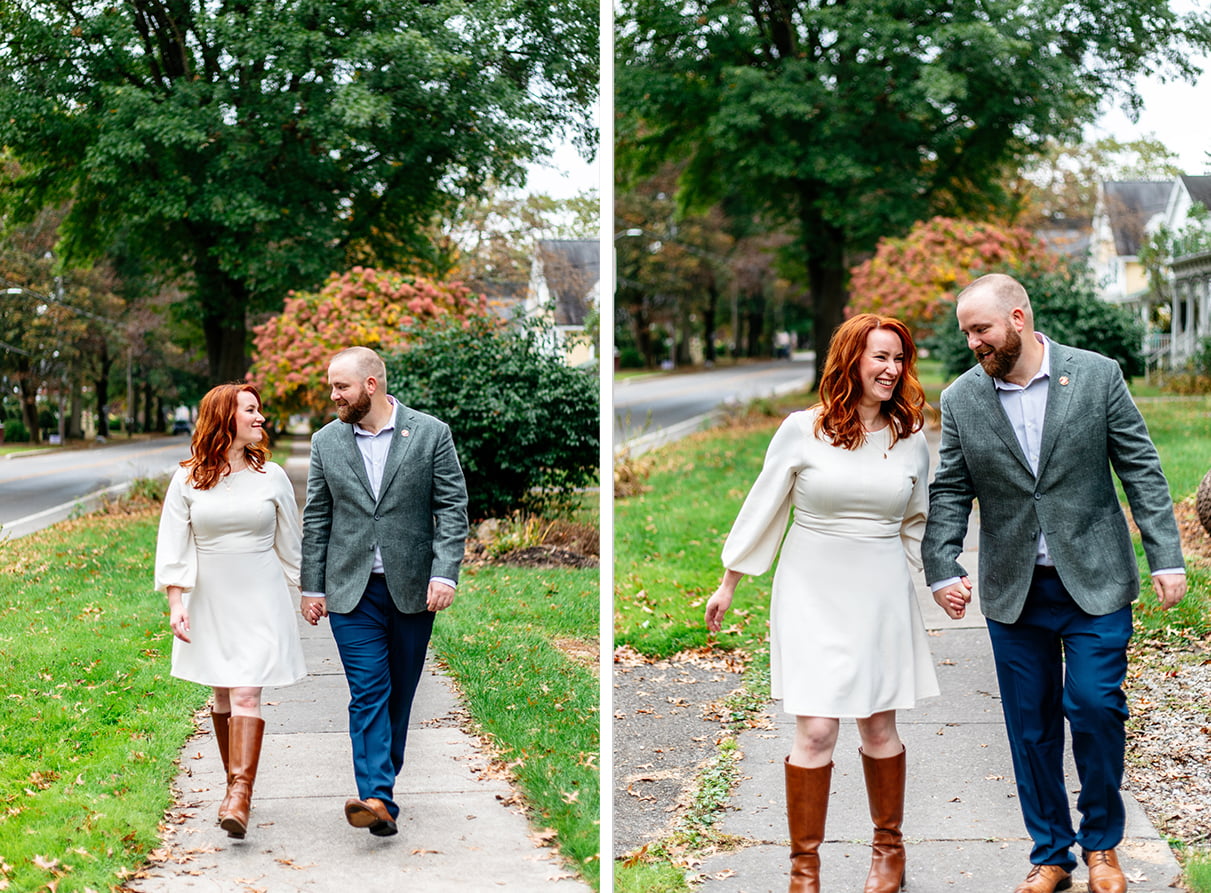 bride and groom hold hands and smile while walking down the sidewalk