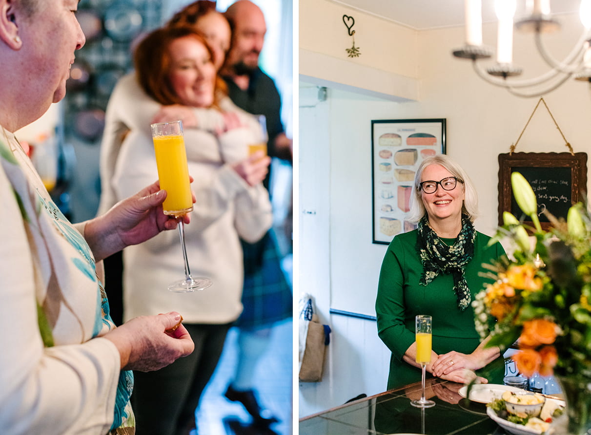 family laughing in kitchen and drinking mimosas