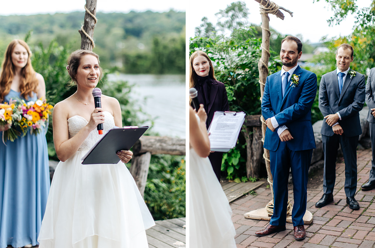 Bride says her vows while groom looks on during lakeside wedding ceremony