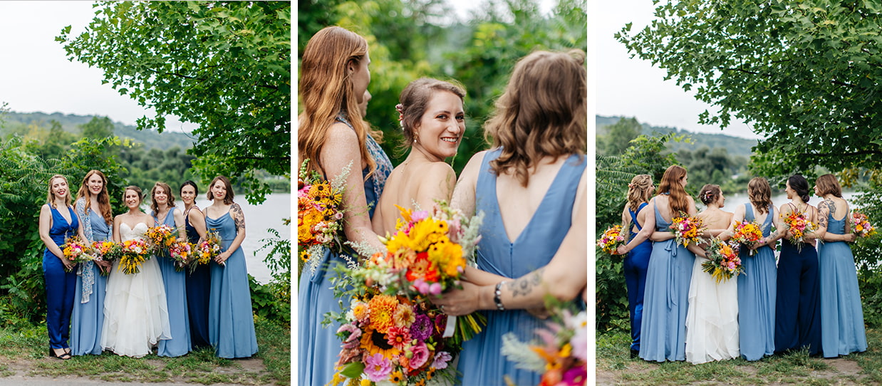 bride stands with her bridesmaids holding colorful sunflower wedding bouquets before Ithaca Farmers Market Wedding