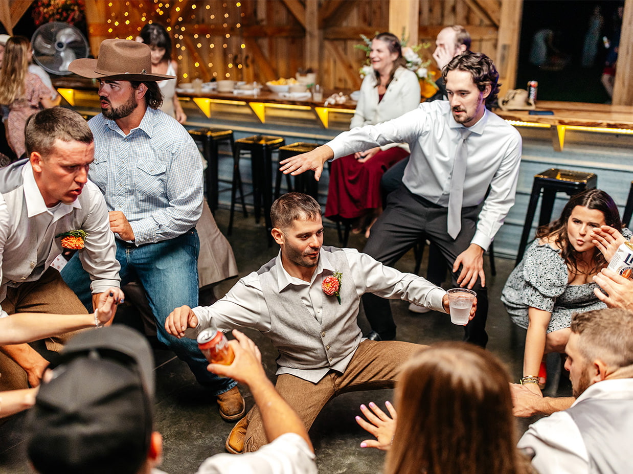 wedding guests dancing during reception at knotting hill farm in jordanville ny