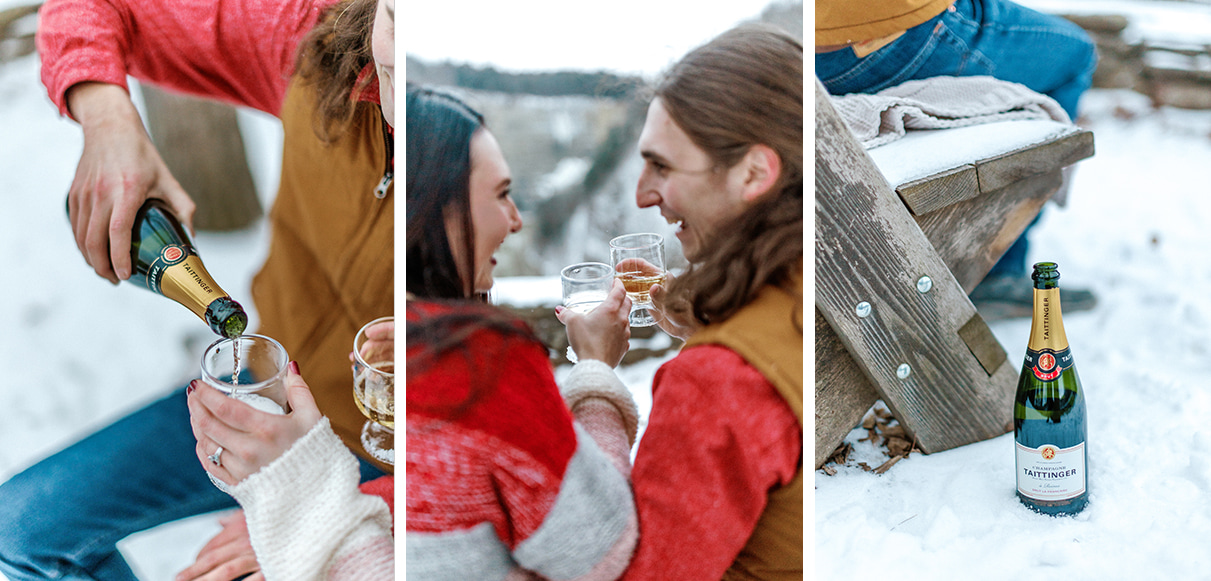 Man pours champagne and couple toasts overlooking gorge in Letchworth State Park in Upstate NY
