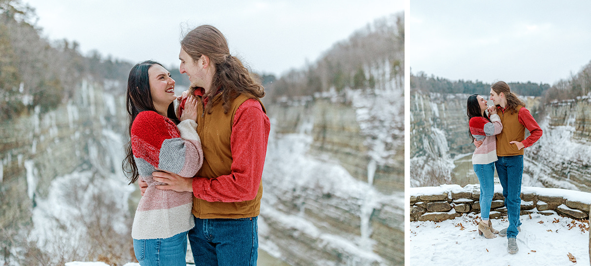 Couple laughs and embraces while wearing colorful sweaters and standing in front of the gorge in Letchworth State Park