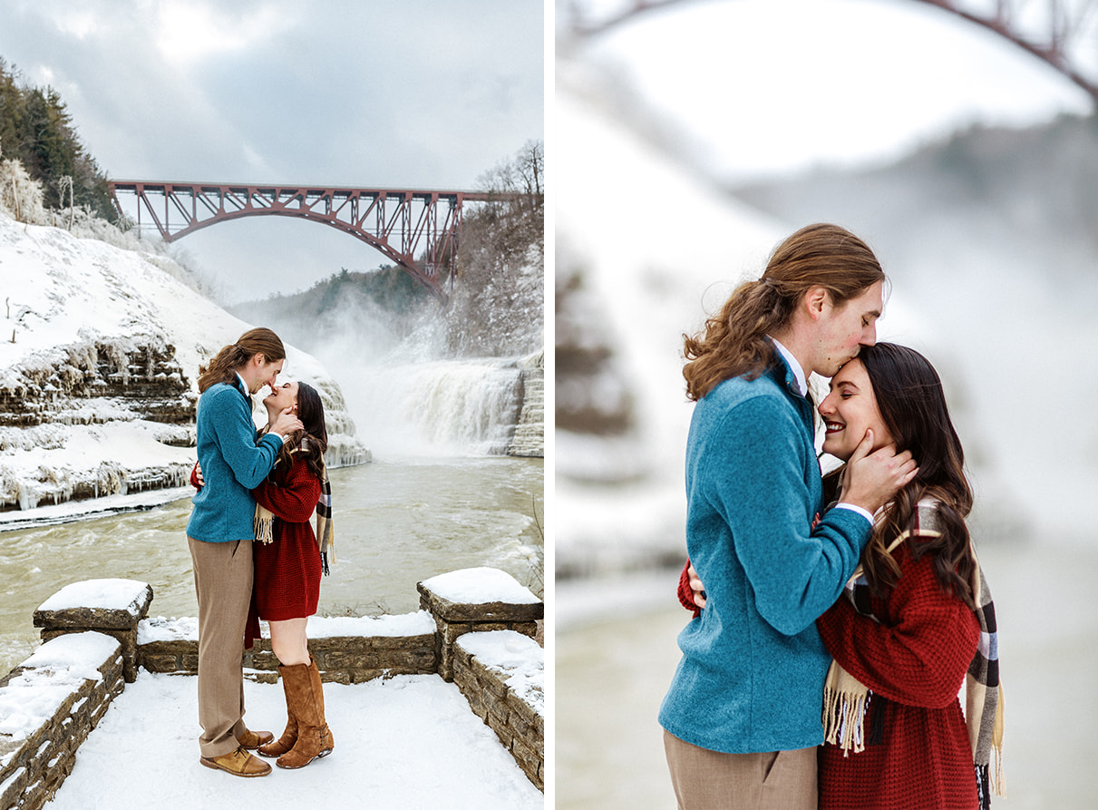 Man kisses woman's forehead in front of the Upper Falls at Letchworth State Park in Castile, NY