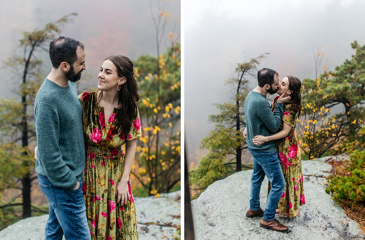 Couple embraces while standing on rocky outlook at Minnewaska State Park during foggy fall engagement photos