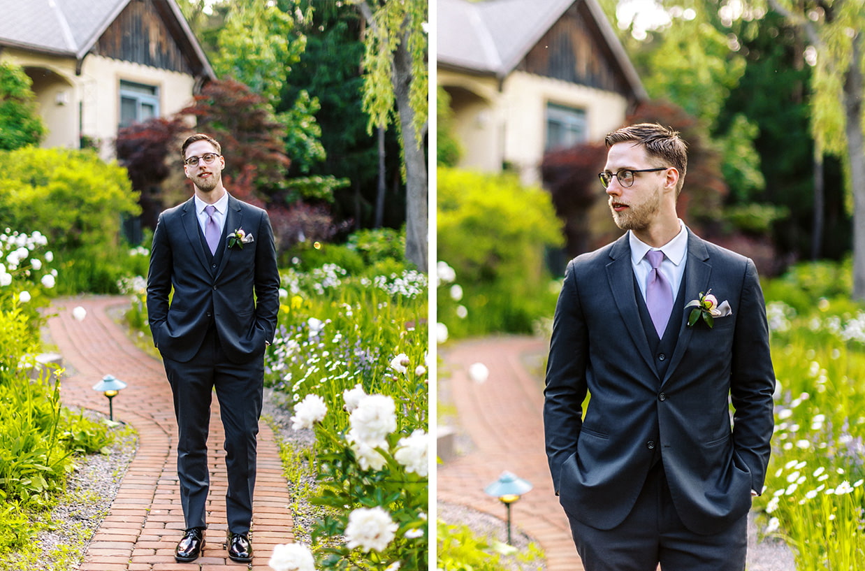 Groom standing on lush pathway at mirbeau inn and spa in Skaneateles ny