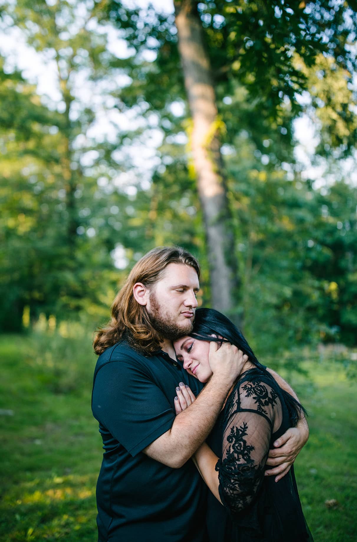 Couple Embraces in field in Scranton PA Engagement shoot 