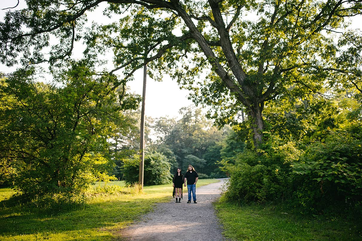 Couple stands holding hands in in Nay Aug Park Engagement Session