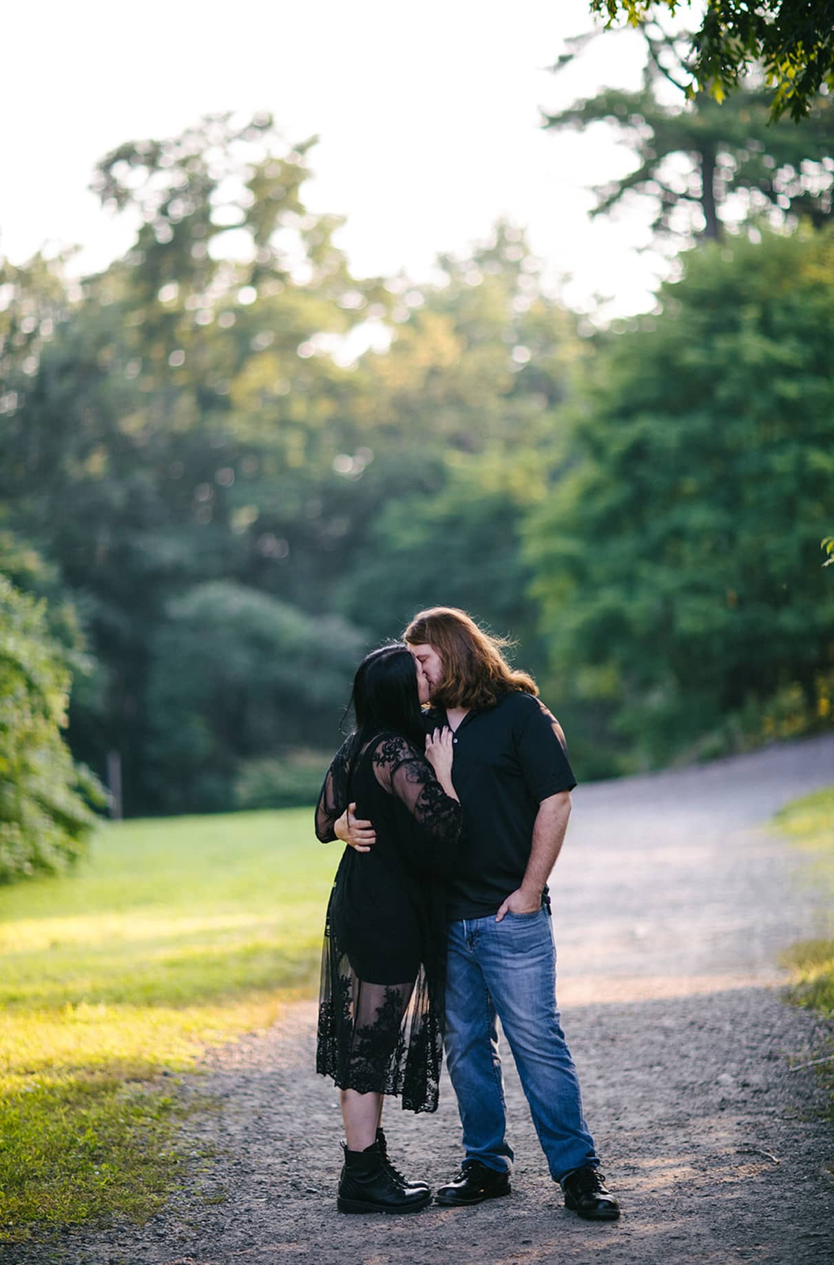Couple kisses on path in Nay Aug Park Engagement Session