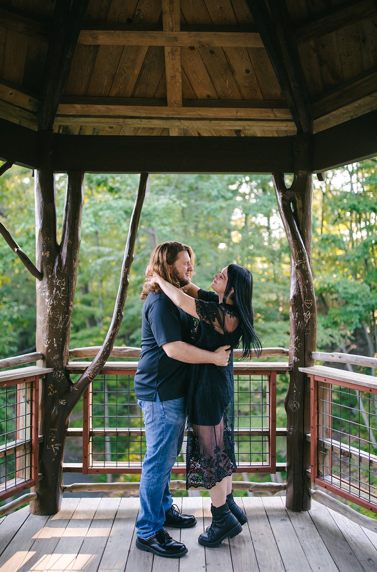 Couple embracing inside David Wenzel Treehouse at Nay Aug Park in Scranton PA