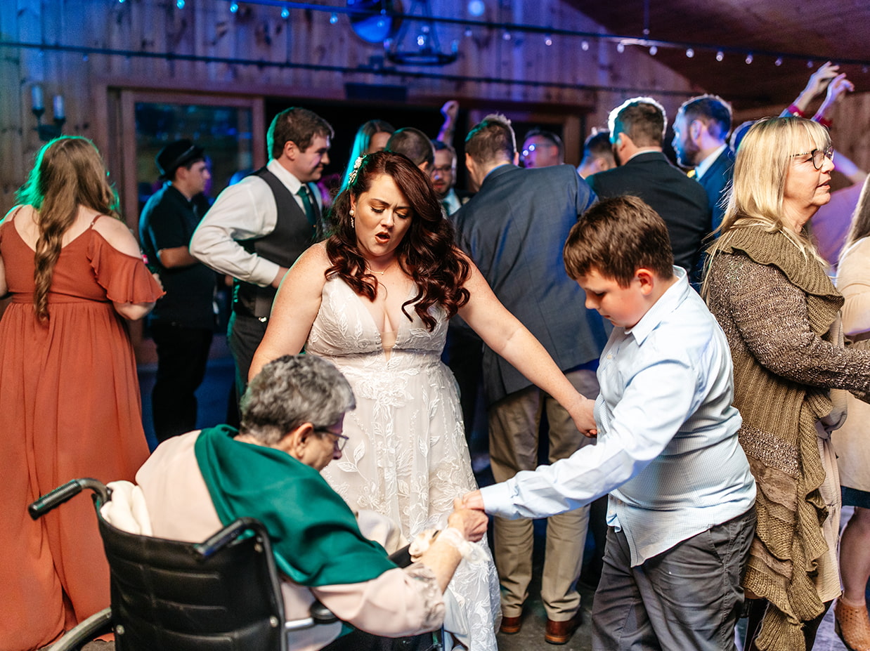 bride dances with her grandma and cousin at New Park Event Venue & Suites in Ithaca NY
