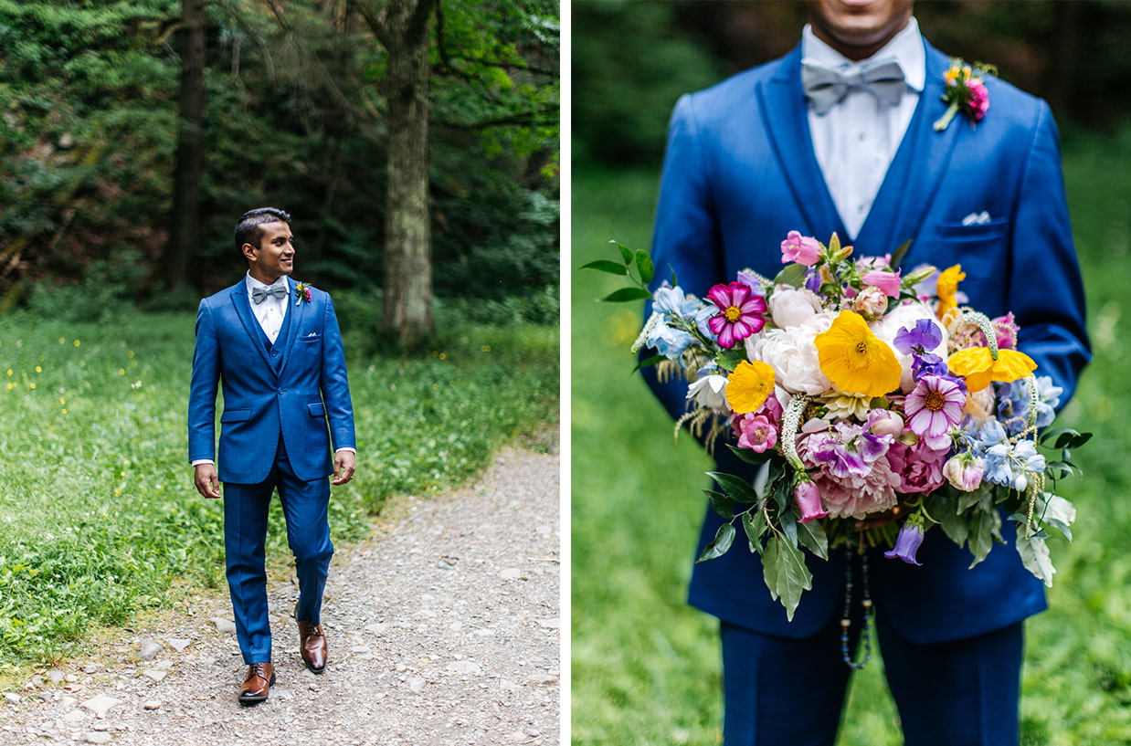 Groom in bright blue suit walks towards camera and holds colorful pink, yellow, and purple bouquet