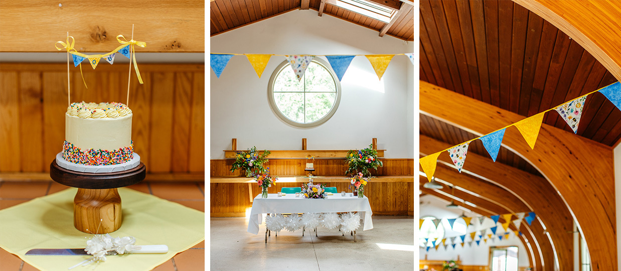 Colorful cake, sweetheart table, and quirky blue and yellow bunting decorations in Robert Treman State Park North Pavilion