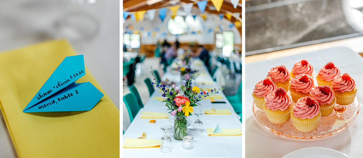 paper airplane wedding placecards, pink raspberry cupcakes, and colorful floral centerpieces