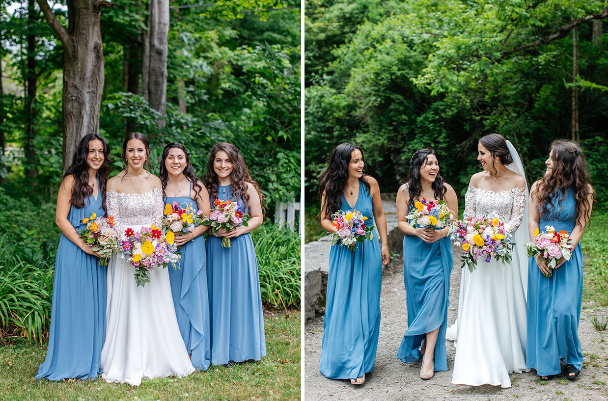 bridesmaids in light blue dresses hold brightly colored bouquets smile and walk together while laughing