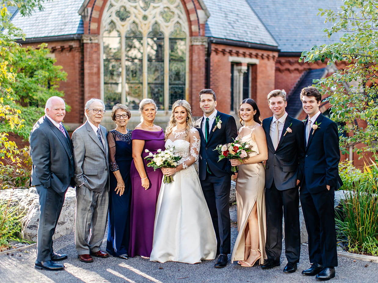Family photo with bride and groom outside Sage Chapel on the Cornell University Campus in Ithaca NY
